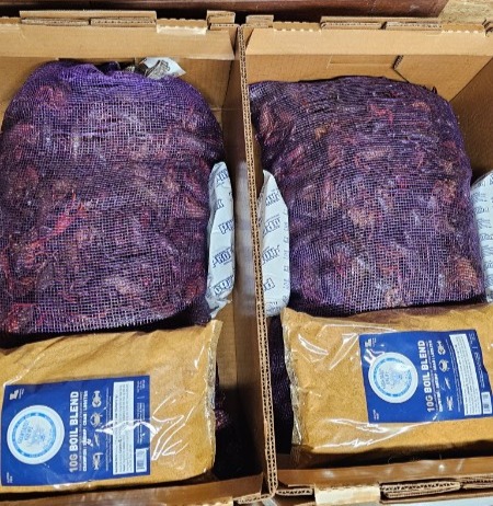 Crawfish packed into seafood boxes with ice packs